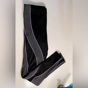 CW-X Endurance Generator Tights Black w/ purple piping and grey muscle accents.